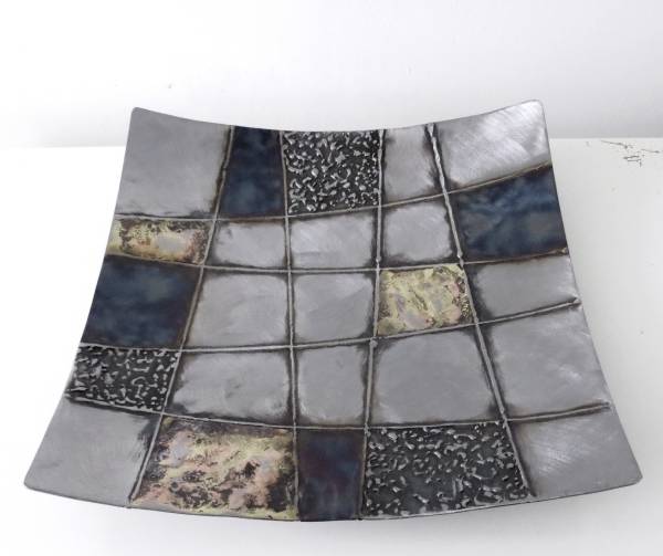 - a , metal Sculpture by Whittle Design, measuring 5 x 33 cm (H x W) £75